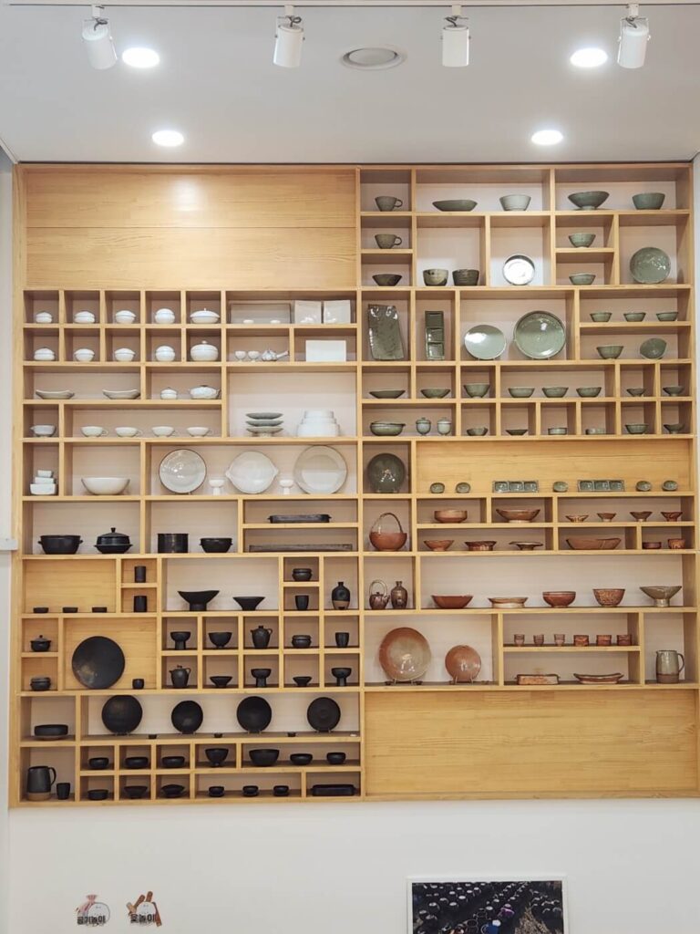 Wall-mounted display of traditional Korean cooking tools and food culture artifacts inside Hansik Space E:EUM Seoul.