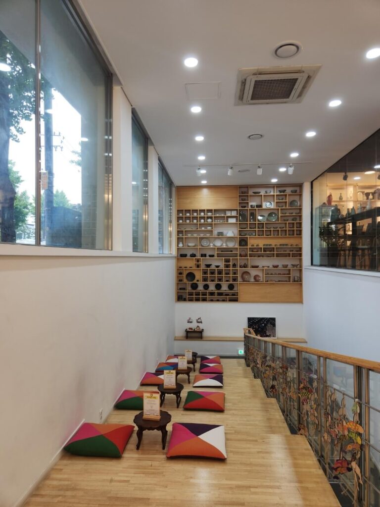 A view of the exhibition area inside Hansik Space E:EUM Seoul, featuring traditional Korean food displays and cultural elements in a modern gallery space.