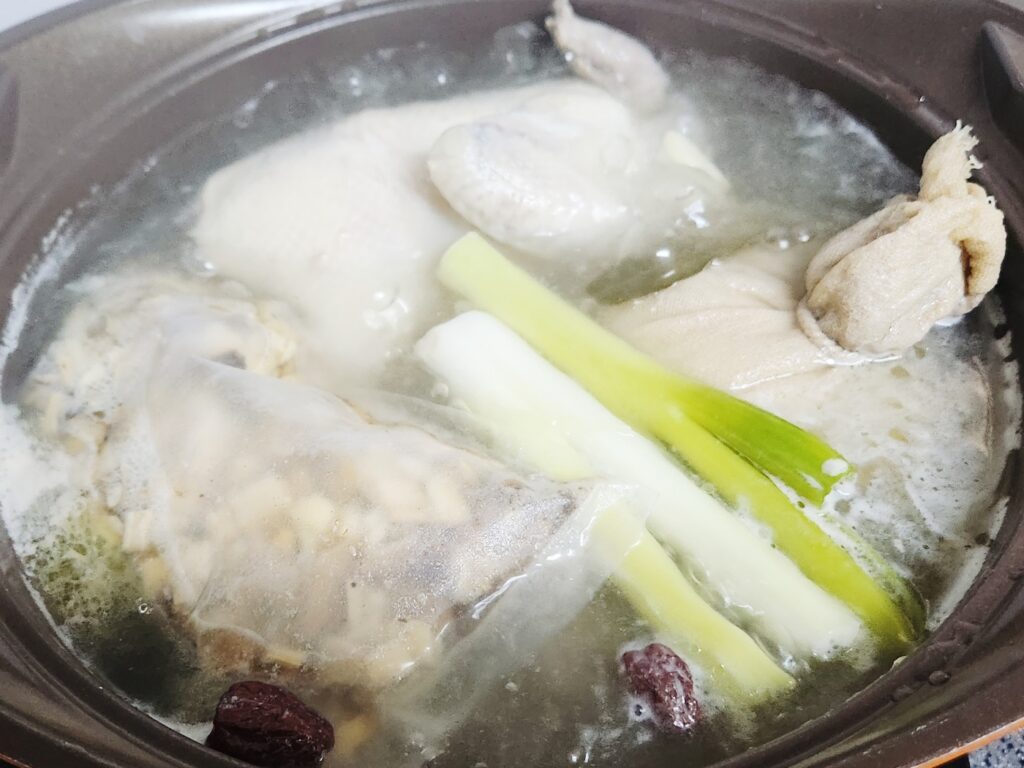 Traditional Korean Samgyetang (ginseng chicken soup) served in a bowl, symbolizing Sambok and Korean summer stamina foods.